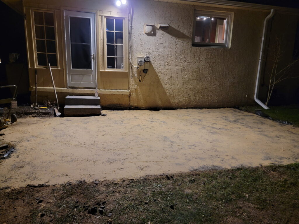 Yellow house sand fill on top of stone