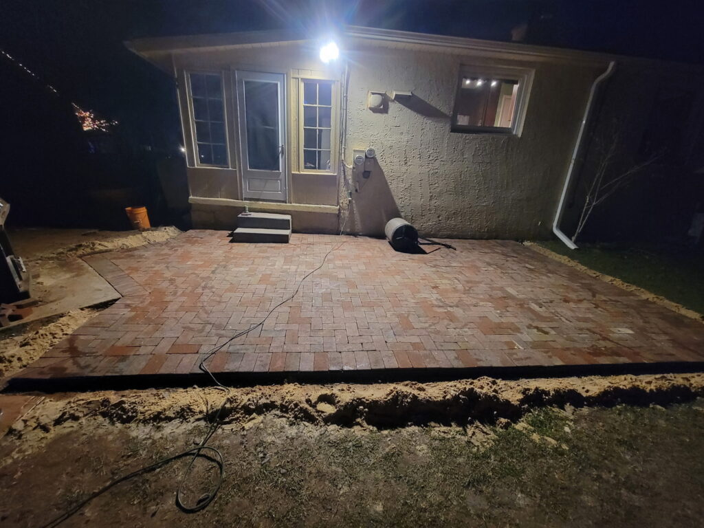 Yellow house paver installation completed