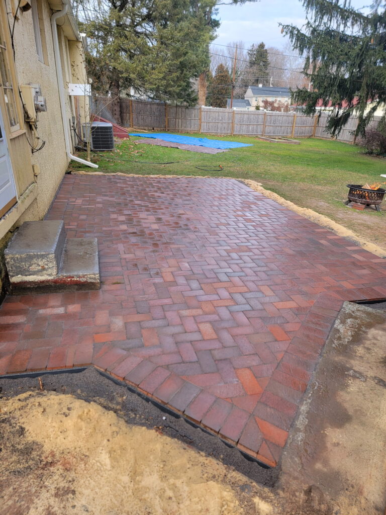 Yellow house paver installation completed and setting