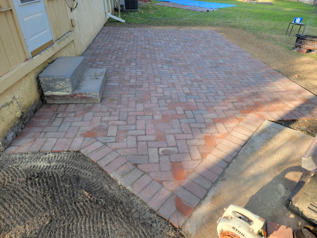 Yellow house paver installation completed and dry